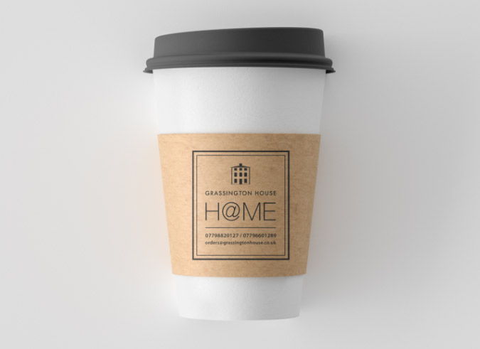 coffee cup featuring @ Home logo